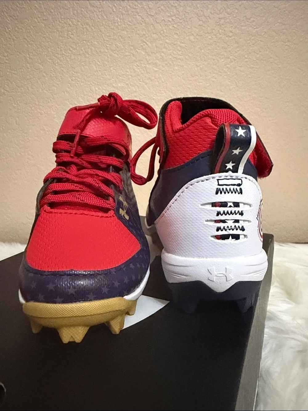 Under Armour Kids Red and Navy Football Cleats with Gold Accents